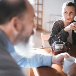 Middle-aged couple enjoying breakfast together.