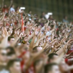 Crowd clapping on the podium of the stadium