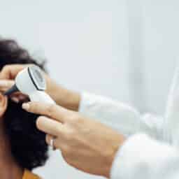 Woman gets ear examined